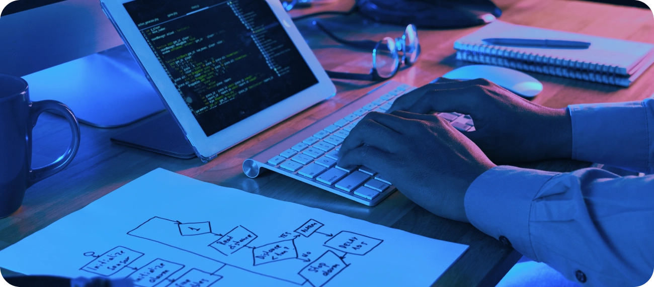 Designers and developers collaborating at workspace in teamwork section, illustrating collaborative approach, cross-functional teams, and integrated design-development projects by Craze For Marketing Sydney agency.